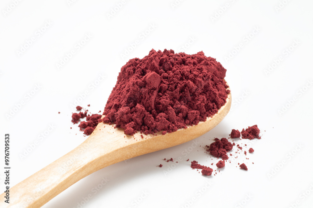 Red yeast rice powder in wooden spoon, Chinese traditional food and medicine Red yeast rice powder in wooden spoon, Chinese traditional food and medicine
