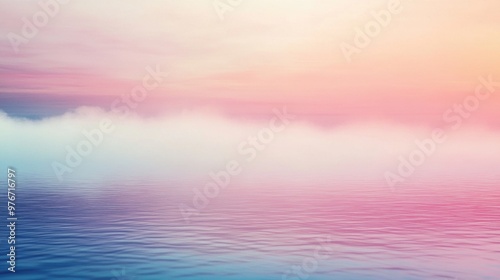 Serene pastel sunset over calm ocean with soft clouds on the horizon