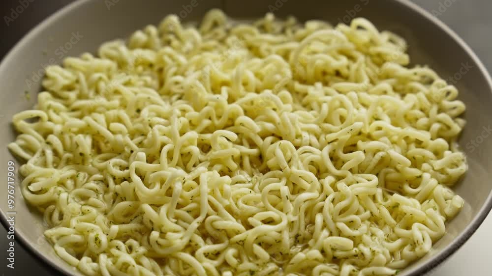 Appetizing instant noodles on plate rotating. Delicious food. Cooked traditional noodle. Food concept. Traditional asian meal. Close-up in 4K, UHD