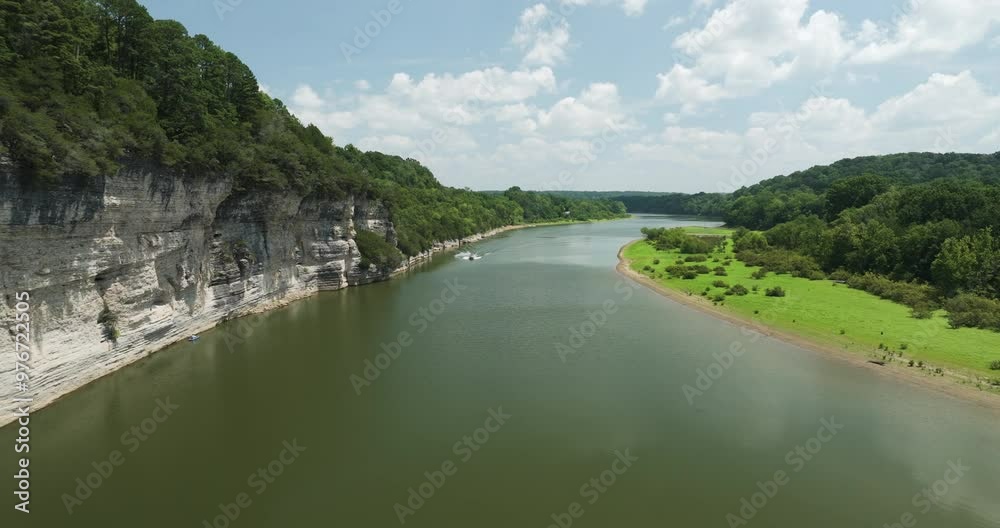 Scenic aerial view of Beaver Lake, Arkansas on a sunny day with lush greenery and calm waters Scenic aerial view of Beaver Lake, Arkansas on a sunny day with lush greenery and calm waters