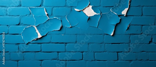 Old worn wall with layers of chipped paint and plaster, grungy textures in faded blue and white tones, exposed brick in some areas, moody lighting with shadows adding depth