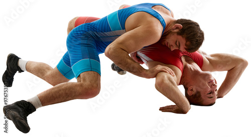 Cuadro en lienzo Two young athlete man, skilled wrestlers in red and blue uniform wrestling in motion against transparent background
