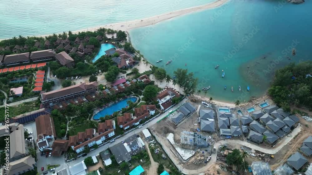 Aerial waterfront resort in Ko Pha Ngan or Koh Phangan Island in Gulf of Thailand , Koh Nang Yuan white sand beach drone top down view