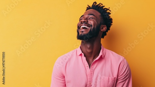 Portrait of a happy handsome man in a shirt with laughing