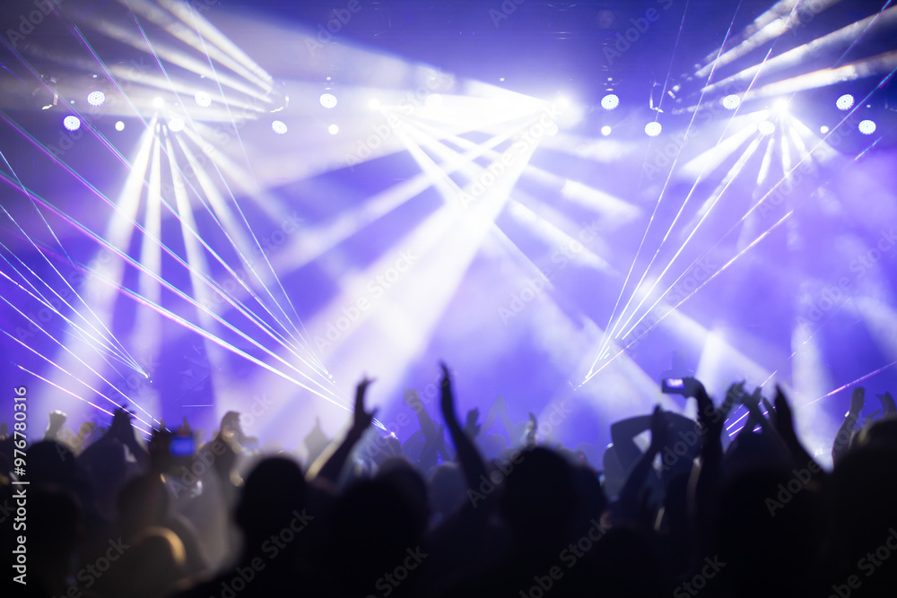 Fototapeta premium Crowd at concert and colorful stage lights.
