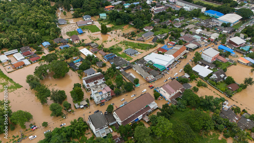 Tablou pe pânză Aerial view of Chiang Rai downtown flooding by Kok river after typhoon Yagi has swept Southeast Asia