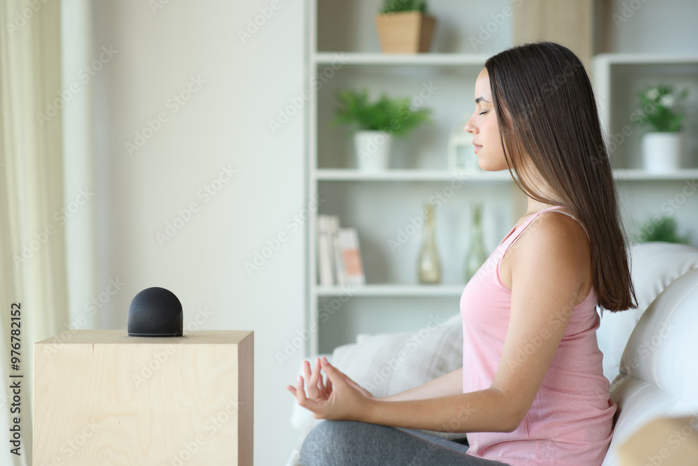 Yogi doing yoga with smart speaker Yogi doing yoga with smart speaker