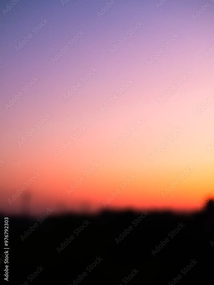 Obraz premium Sunset blur nature summer background cloud gradient overlay dramatic weather orange sky evening sunrise pastel color effect pattern abstract spring light beauty template yellow wallpaper tropical