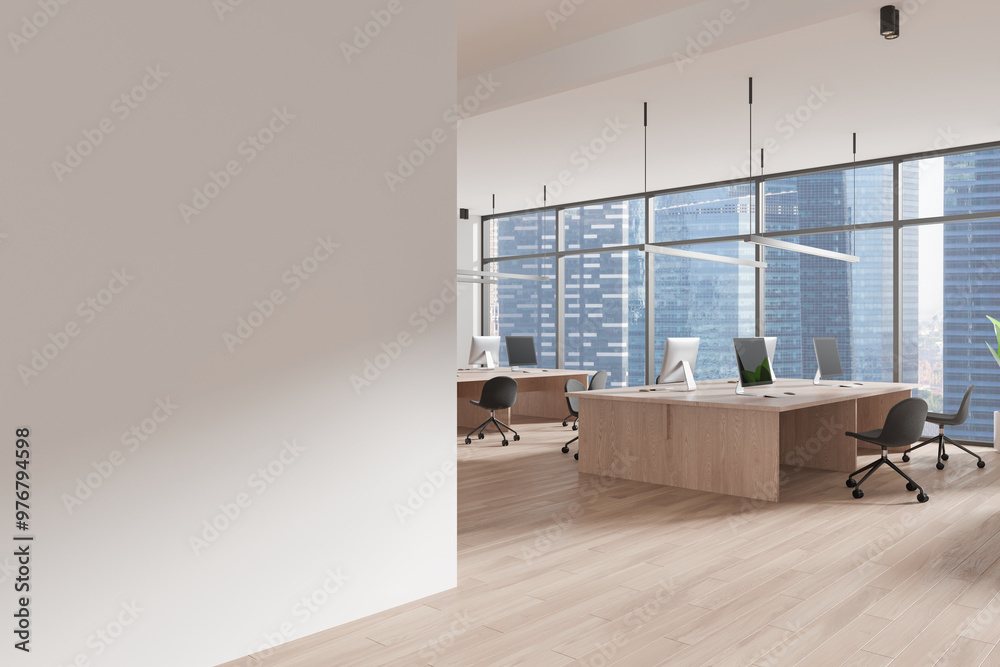 Fototapeta premium An open space office interior featuring large windows overlooking a cityscape, wooden desks, and chairs. Modern design concept for coworking spaces. 3D Rendering