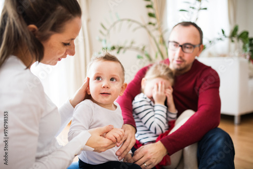 Family portrait. Young happy nuclear family with two kids.