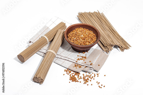 Japanese buckwheat soba noodles. Classic ingredient for preparing traditional dishes. Ceramic bowl photo