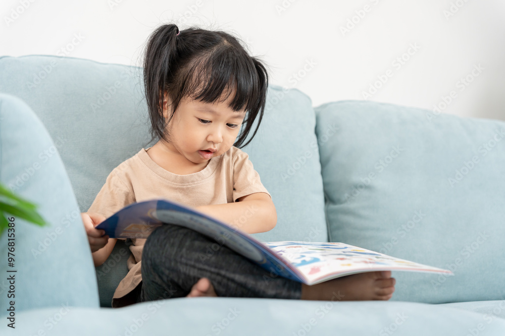 Happy Asian children relax read book at home. daughter and reading a story. learn development, childcare, laughing, education, storytelling, practice, imagine, reduce addiction mobile phone Happy Asian children relax read book at home. daughter and reading a story. learn development, childcare, laughing, education, storytelling, practice, imagine, reduce addiction mobile phone