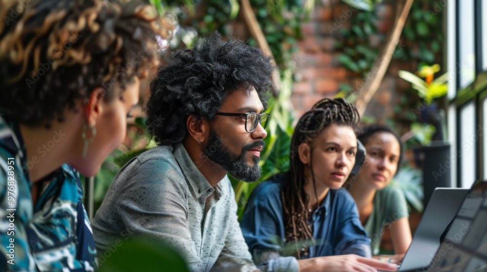 Group of diverse professionals collaborating in a cozy workspace surrounded by plants during a brainstorming session Group of diverse professionals collaborating in a cozy workspace surrounded by plants during a brainstorming session
