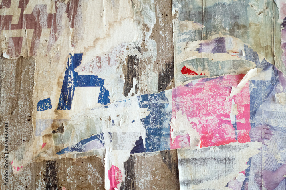 Torn and ripped street poster background. Messy weathered paper collage Torn and ripped street poster background. Messy weathered paper collage
