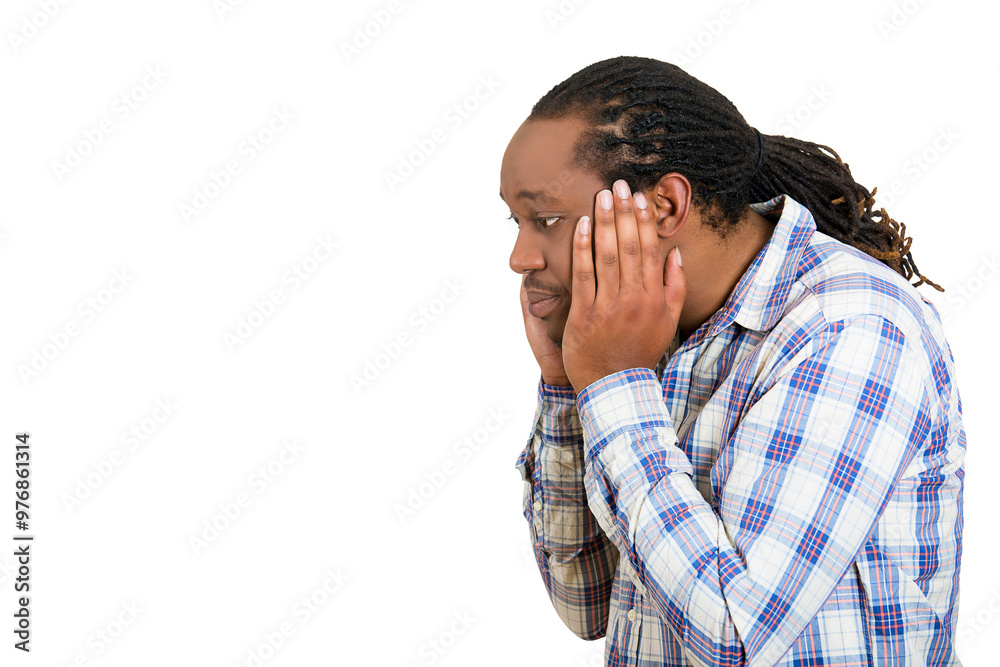 Closeup side view profile portrait of a sad bothered stressed serious young man chin on hands really depressed about something, isolated white Closeup side view profile portrait of a sad bothered stressed serious young man chin on hands really depressed about something, isolated white