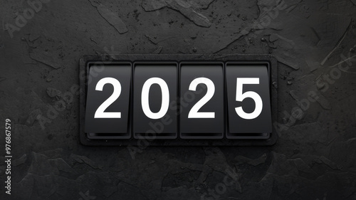 A dark, textured background with a series of flip-style panels displaying the year '2025'. The panels are arranged vertically, with each displaying a white number against a black background.