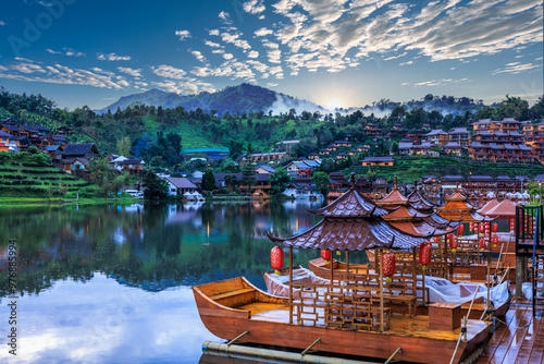 HDR Process Raft And Chinese buildings in Ban Rak Thai Village And Blue Sky With Moutain Backgrounds, reflection concept. photo