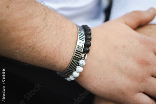 close up of hand holding a necklace