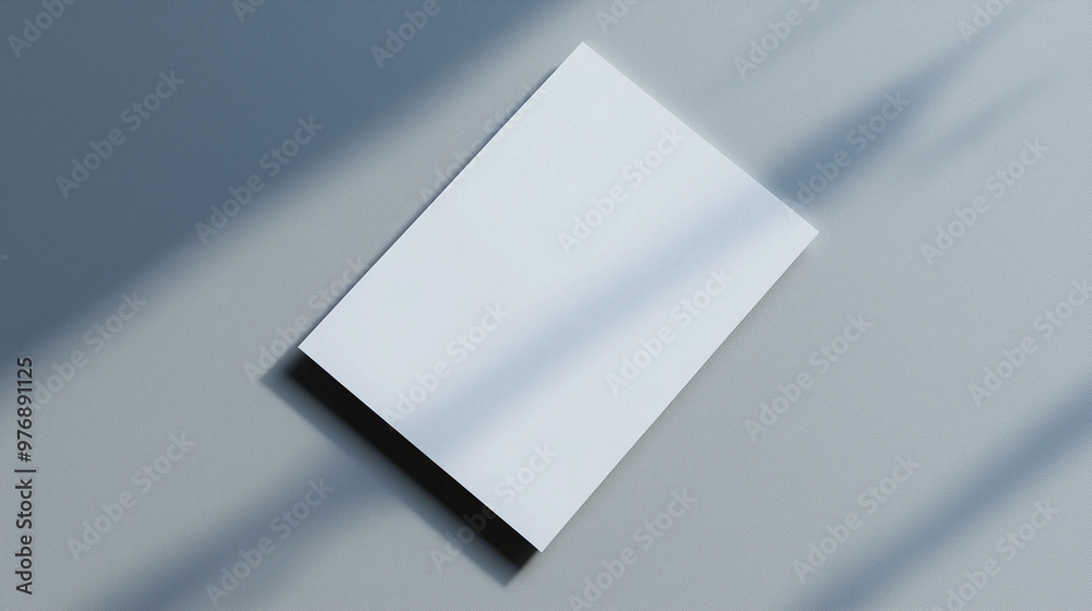 Minimal blank letterhead mockup with soft shadow on neutral gray background Minimal blank letterhead mockup with soft shadow on neutral gray background