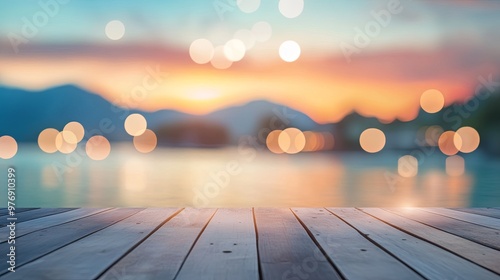 A serene sunset over a calm lake, with blurred lights creating a dreamy atmosphere.