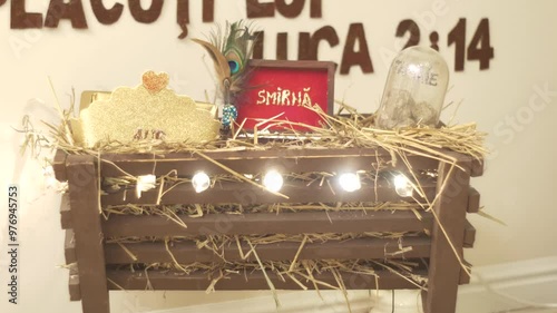 Christmas decoration. Manger with straw. Gold, Myrrh and Incense photo