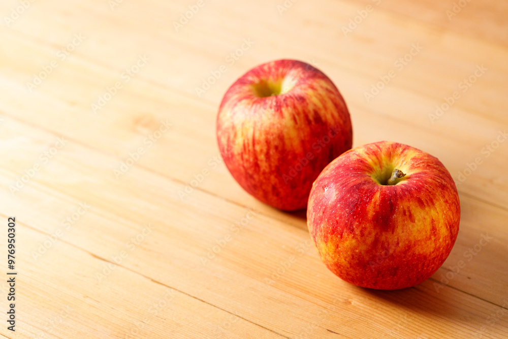 Ripe organic red apple on wooden table background. Ripe organic red apple on wooden table background.
