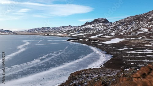 Wallpaper Mural Mountainous Iceland Covered in Thin Blanket of Snow and Frozen Lake, Sweeping Drone Shot Torontodigital.ca