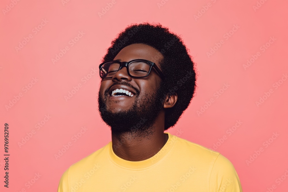 An isolated portrait of a happy young man on a blue background An isolated portrait of a happy young man on a blue background