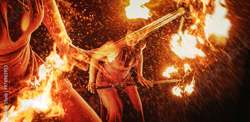 An enchanting fire dancer beautifully showcases her talent with mesmerizing flames during a performance.