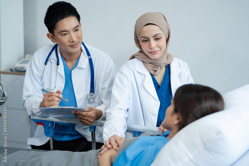 doctor talking with man patient for monitoring and check up after surgery. doctor touching patient hand and consoling. doctor talking with man patient for monitoring and check up after surgery. doctor touching patient hand and consoling.