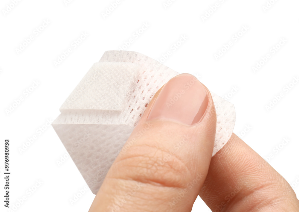 Woman putting medical adhesive bandage on white background, closeup Woman putting medical adhesive bandage on white background, closeup