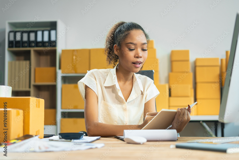 Woman start up online seller owner at workplace. small business entrepreneur SME or freelance asian woman working with box at home. Woman start up online seller owner at workplace. small business entrepreneur SME or freelance asian woman working with box at home.