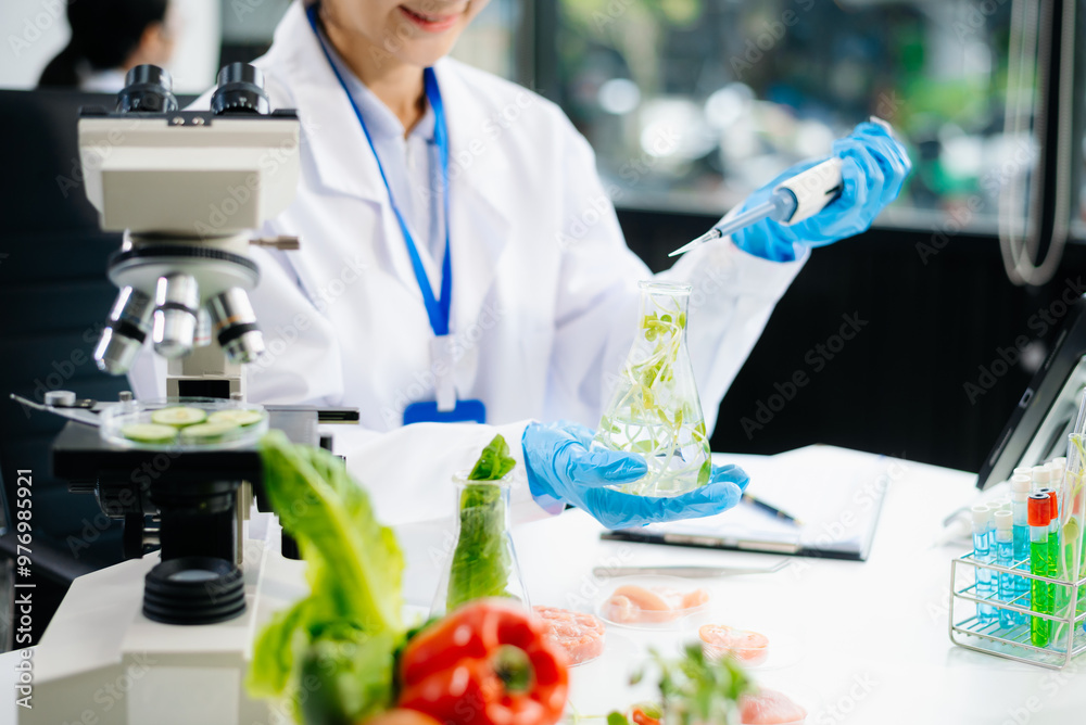 Food scientists in lab coats, testing samples, and analyzing food safety and quality Food scientists in lab coats, testing samples, and analyzing food safety and quality