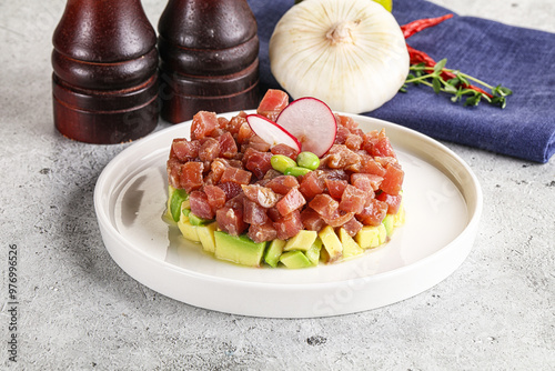 Tuna tartar with avocado and sauce photo