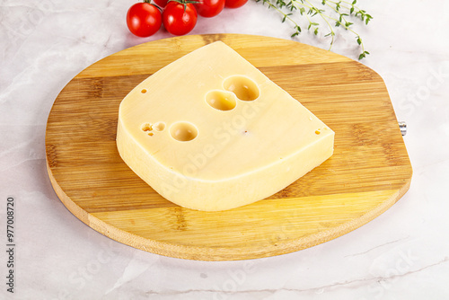 Maasdam cheese brick over board