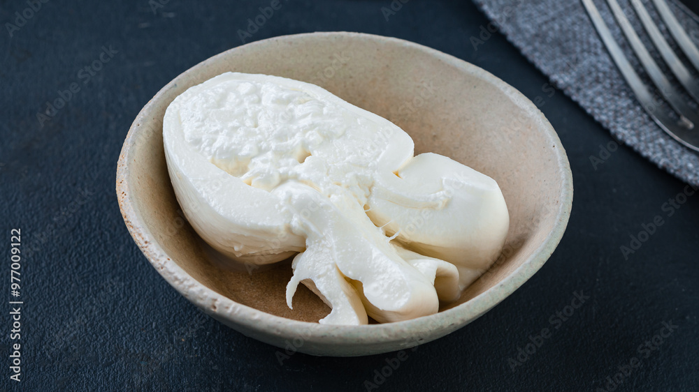 Fresh soft white burrata, ball buttery cheese, made from a mix of mozzarella and ricotta cream Fresh soft white burrata, ball buttery cheese, made from a mix of mozzarella and ricotta cream