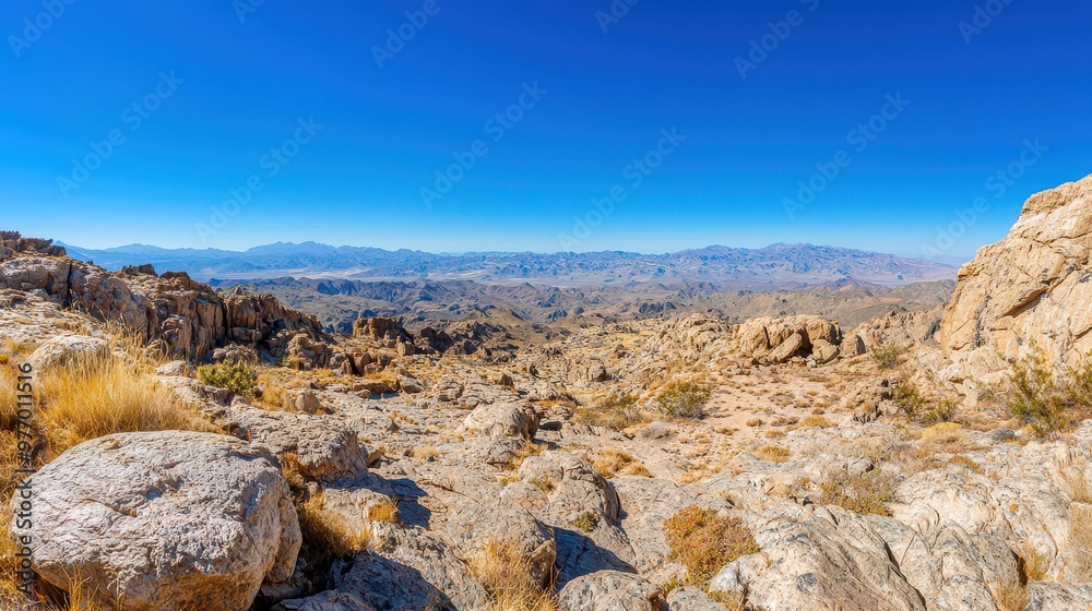 Mountainous Landscape with Blue Sky and Rugged Terrain
