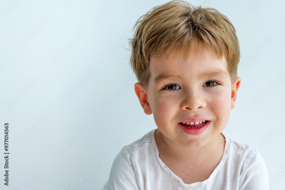 portrait of cute laughing little boy on grey background portrait of cute laughing little boy on grey background