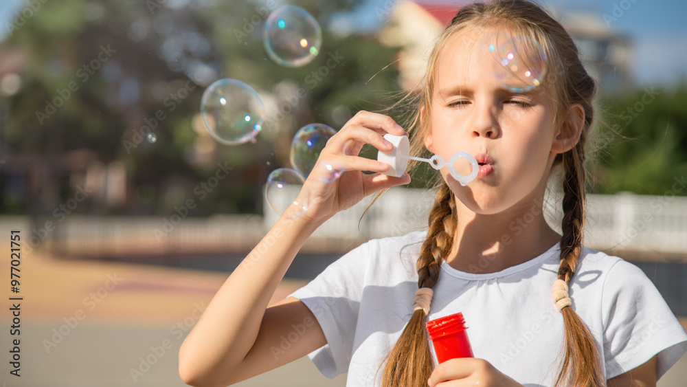 Little girl blowing soap bubbles Little girl blowing soap bubbles