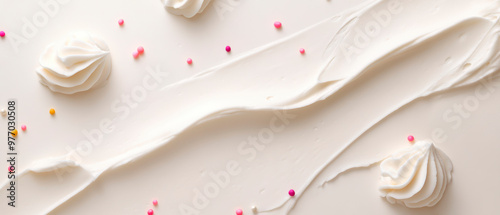 A white, creamy texture of frosting cream spread across the frame.  Small swirls in the corners and colorful sprinkles, primarily pink and yellow, scattered throughout. Generative AI photo