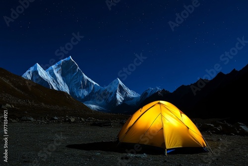 In Nepal's Khumbu region, there are two illuminated tents at Lobuche East's basecamp. There are also the peaks of Taboche and Cholatse in the distance.