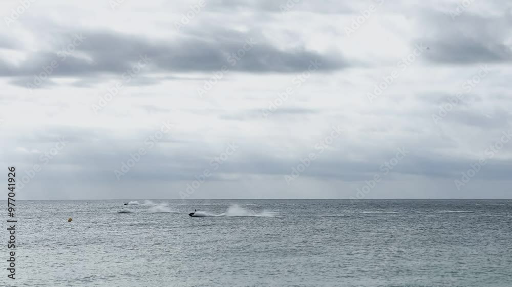 Jet skis speeding along the coast of the Mediterranean Sea.
Jet skis speeding along the coast of the Mediterranean Sea.