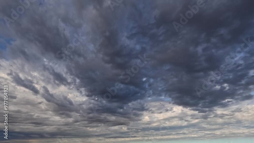 pretty timelapse with massive gray rain clouds - loop video