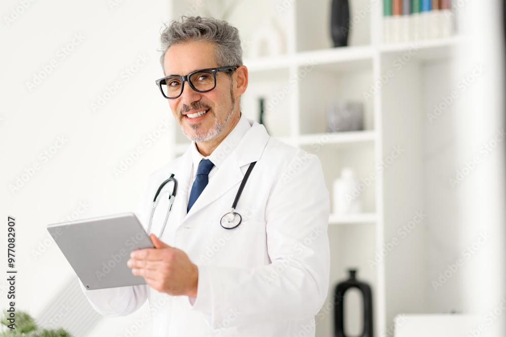 Cheerful doctor interacting with a tablet, embodying the blend of personal touch and technological advancement in medicine. The organized office promoting a sense of trust and modernity Cheerful doctor interacting with a tablet, embodying the blend of personal touch and technological advancement in medicine. The organized office promoting a sense of trust and modernity