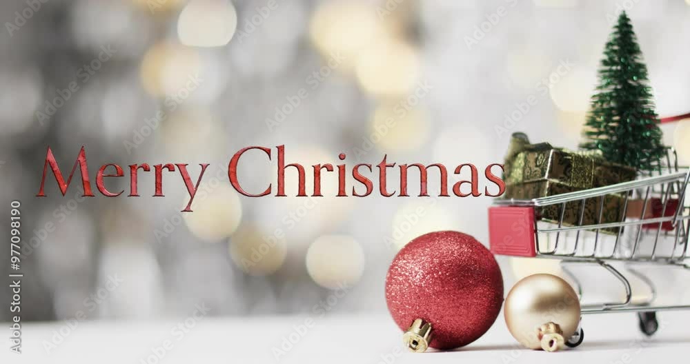 Merry christmas text in red over baubles and christmas tree in shopping cart with bokeh background