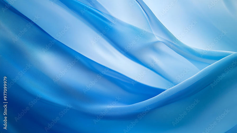 Obraz premium Soft blue chiffon fabric draping elegantly in gentle waves under natural light