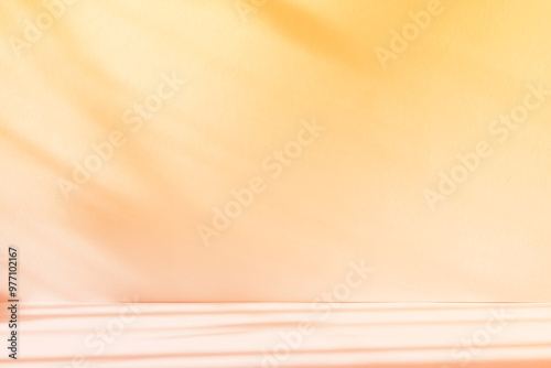 Abstract yellow color gradient studio background for product presentation. Empty room with shadows of window and flowers and plant leaves . 3d room with copy space. Summer concert. Blurred backdrop.