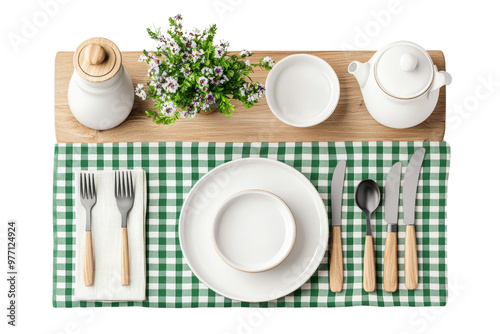 Table setting with white dishes, cutlery, and fresh flowers on a checkered tablecloth photo