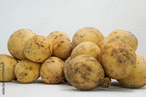 Close-up of longkong (Lansium) fruit isolated on white background. It is a popular fruit. photo
