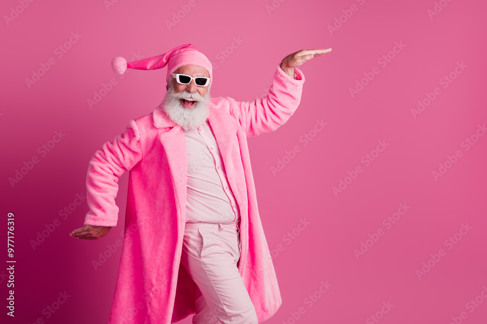 Photo of cheerful funny old man wear trendy bathrobe energy dance chill rhythm empty space isolated on pink color background